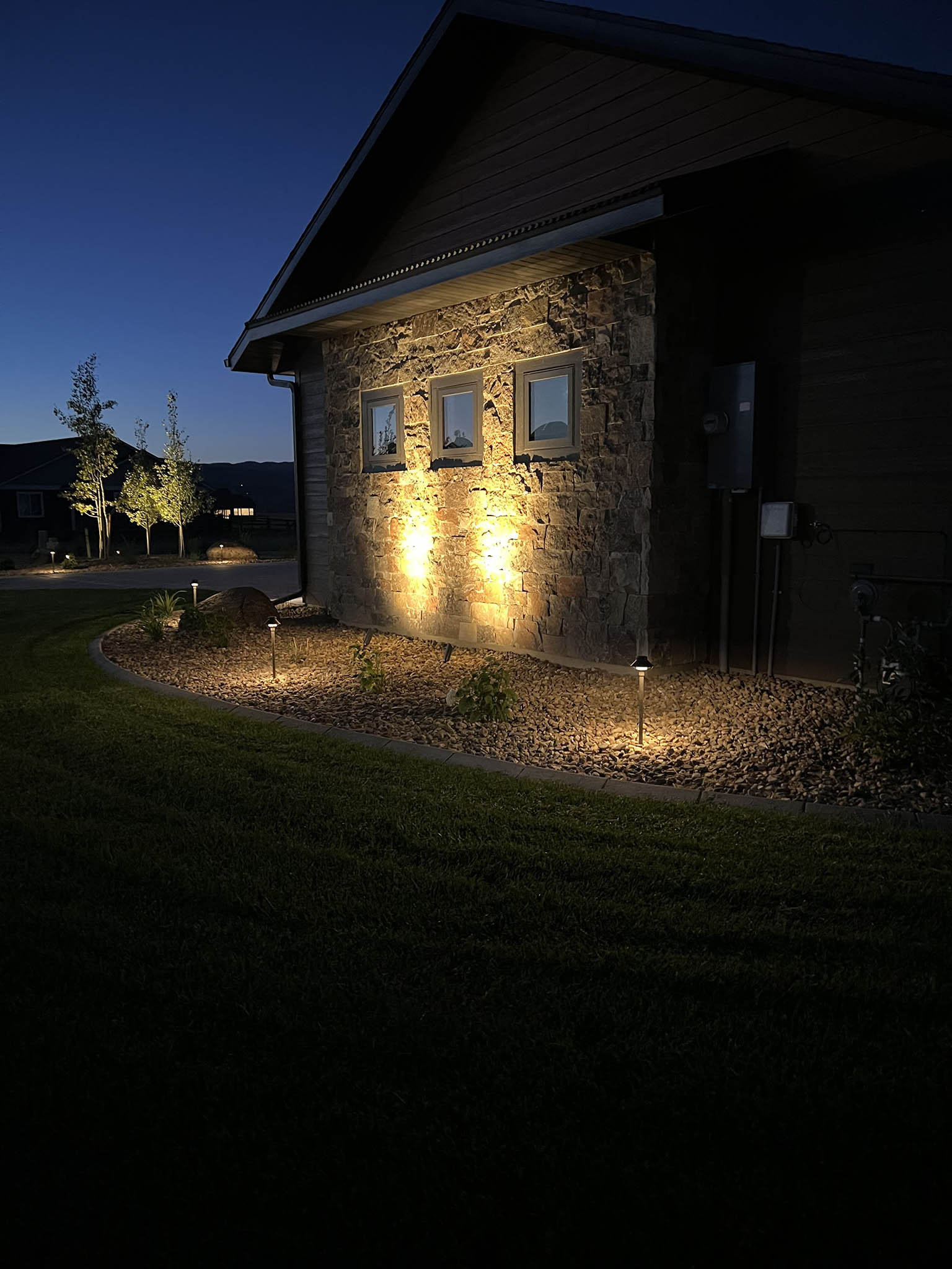 outdoor lighting illuminating residential landscaping